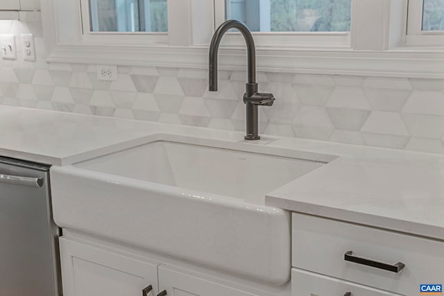 10A Sablewood Dr, Charlottesville, VA 22911 - detailed view of a sink, backsplash, white cabinets, and dishwasher