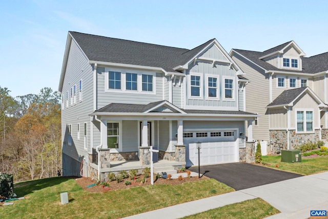 10A Sablewood Dr, Charlottesville, VA 22911 - craftsman-style home with covered porch, asphalt driveway, stone siding, and a front yard