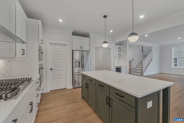 10A Sablewood Dr, Charlottesville, VA 22911 - kitchen featuring appliances with stainless steel finishes, white cabinetry, crown molding, tasteful backsplash, and baseboards