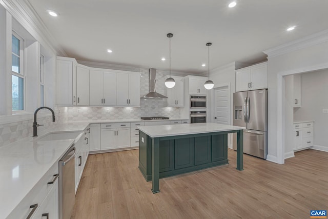 10A Sablewood Dr, Charlottesville, VA 22911 - kitchen featuring appliances with stainless steel finishes, wall chimney exhaust hood, a sink, decorative backsplash, and white cabinets