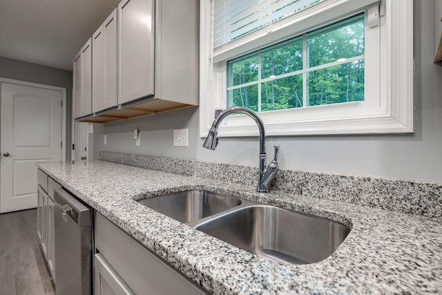 4001 Moreland Gap Rd, New Market, VA 22844 - kitchen featuring a sink, stainless steel dishwasher, light stone counters, and wood finished floors