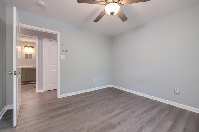 4001 Moreland Gap Rd, New Market, VA 22844 - spare room with wood finished floors, baseboards, ceiling fan, and a smoke detector