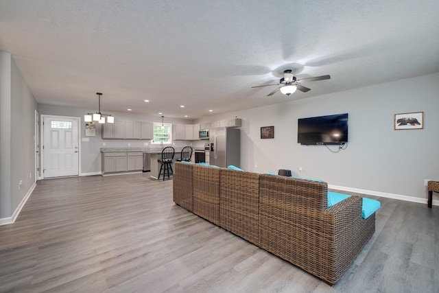 4001 Moreland Gap Rd, New Market, VA 22844 - living area with wood finished floors, baseboards, a ceiling fan, recessed lighting, and a chandelier