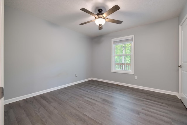 4001 Moreland Gap Rd, New Market, VA 22844 - spare room with dark wood-style flooring, baseboards, and ceiling fan