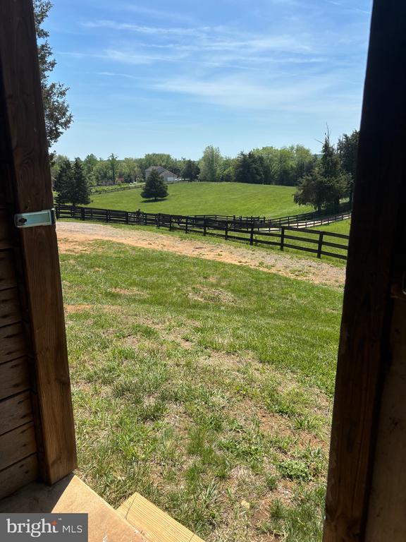  - view of yard featuring a view of rural / pastoral area