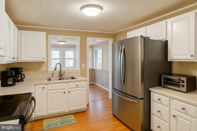 335 Deer Crossing Ln, Orange, VA 22960 - kitchen with a sink, light wood finished floors, freestanding refrigerator, white cabinetry, and light countertops
