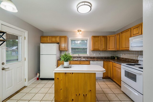78 Stuart Ave, Stuarts Draft, VA 24477 - kitchen with white appliances, a sink, a kitchen island, and backsplash