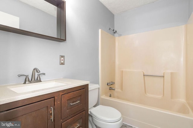 full bath with toilet, shower / tub combination, vanity, and a textured ceiling