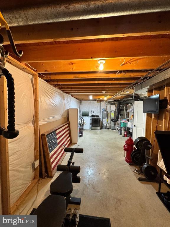 10010 Peppermill Ct, Fredericksburg, VA 22407 - unfinished basement featuring gas water heater and washer and clothes dryer