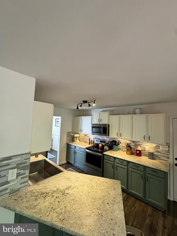 10010 Peppermill Ct, Fredericksburg, VA 22407 - kitchen featuring appliances with stainless steel finishes, decorative backsplash, and dark wood-style floors