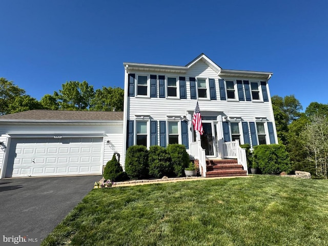 10010 Peppermill Ct, Fredericksburg, VA 22407 - colonial inspired home featuring a front lawn, asphalt driveway, and a garage