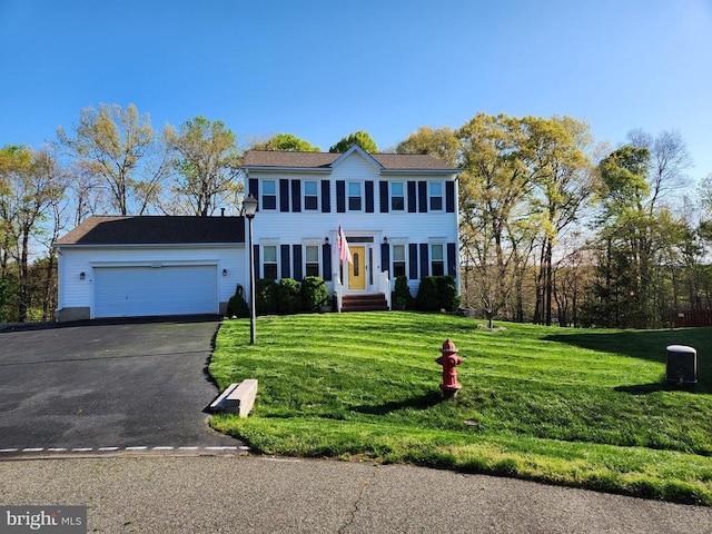 10010 Peppermill Ct, Fredericksburg, VA 22407 - colonial house featuring an attached garage, asphalt driveway, and a front lawn
