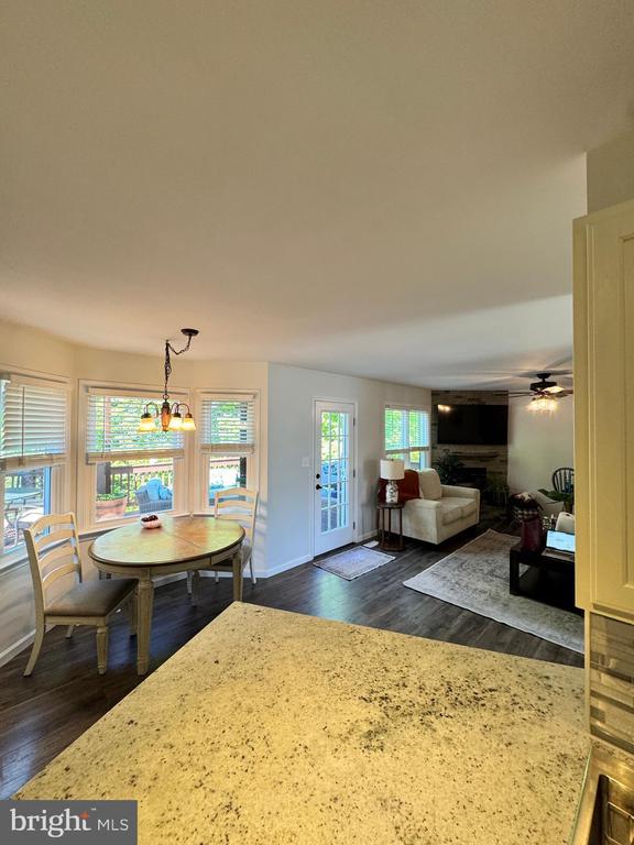 10010 Peppermill Ct, Fredericksburg, VA 22407 - dining room with dark wood finished floors, a ceiling fan, and a chandelier