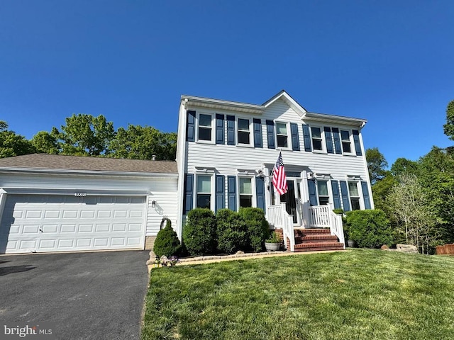 10010 Peppermill Ct, Fredericksburg, VA 22407 - colonial inspired home with driveway, a front lawn, and a garage