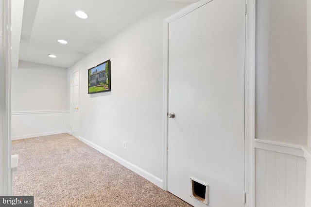  - hall featuring recessed lighting, carpet flooring, and wainscoting