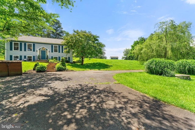  - view of front of home featuring a front lawn