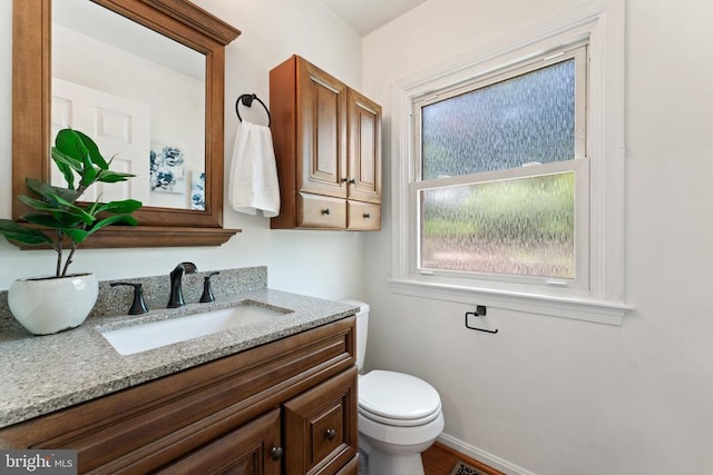  - half bathroom with vanity and toilet