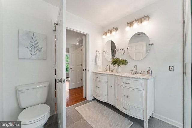  - bathroom with double vanity and tile patterned floors