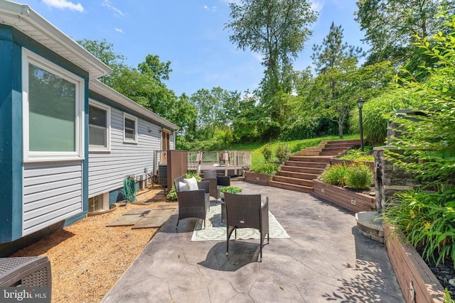  - view of patio / terrace with stairway and a deck