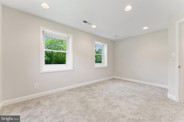  - carpeted empty room with recessed lighting
