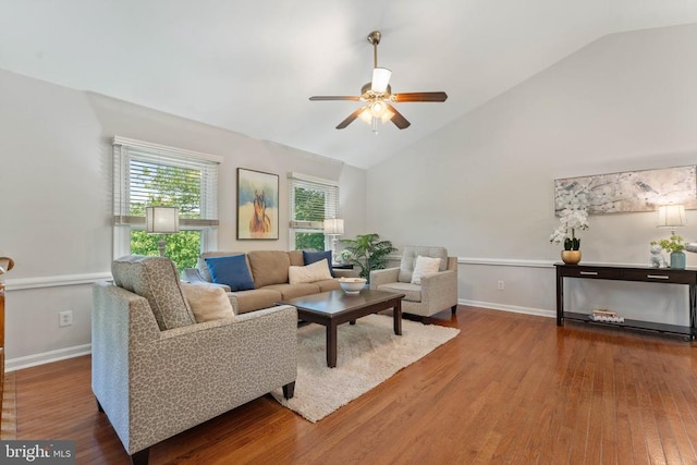  - living area featuring a ceiling fan, wood finished floors, and high vaulted ceiling