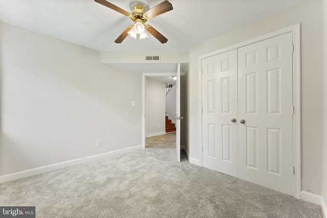  - unfurnished bedroom featuring carpet, a closet, and ceiling fan