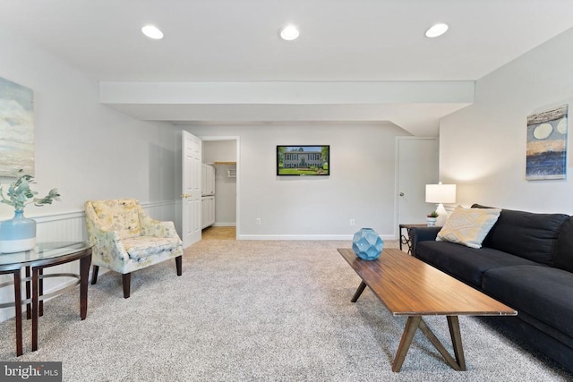  - living area with light colored carpet and recessed lighting
