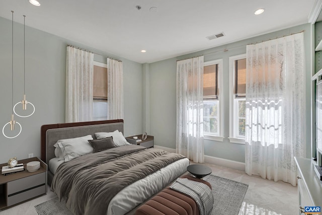 bedroom featuring light colored carpet, baseboards, visible vents, and recessed lighting