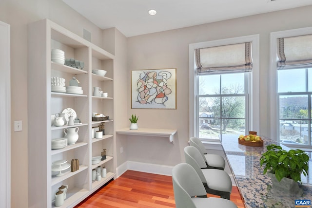 office featuring baseboards and wood finished floors