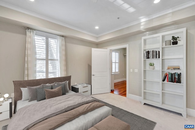 carpeted bedroom featuring baseboards, ornamental molding, and recessed lighting