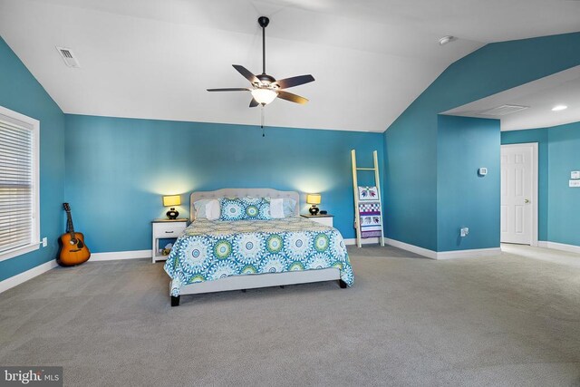 carpeted bedroom featuring vaulted ceiling, baseboards, and ceiling fan