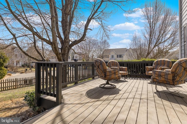 wooden deck featuring a residential view