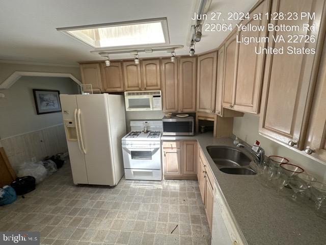 22064 Yellow Bottom Rd, Lignum, VA 22726 - kitchen with white appliances, a sink, track lighting, light countertops, and light flooring
