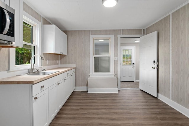 837 Faber Ave, Waynesboro, VA 22980 - kitchen featuring stainless steel microwave, a sink, white cabinetry, dark wood finished floors, and light countertops