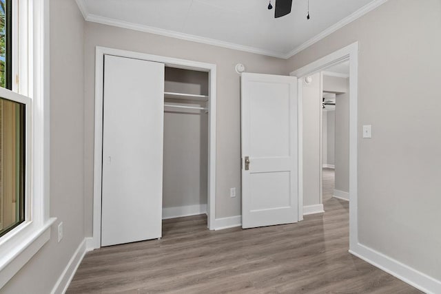 837 Faber Ave, Waynesboro, VA 22980 - unfurnished bedroom featuring crown molding, wood finished floors, a closet, baseboards, and ceiling fan