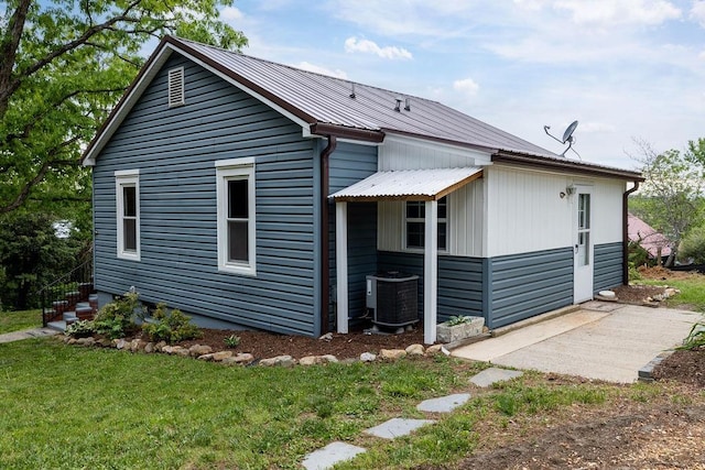 837 Faber Ave, Waynesboro, VA 22980 - back of house featuring cooling unit, metal roof, a patio, and a yard