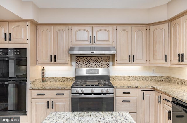 kitchen featuring light brown cabinetry, under cabinet range hood, black appliances, and light stone counters