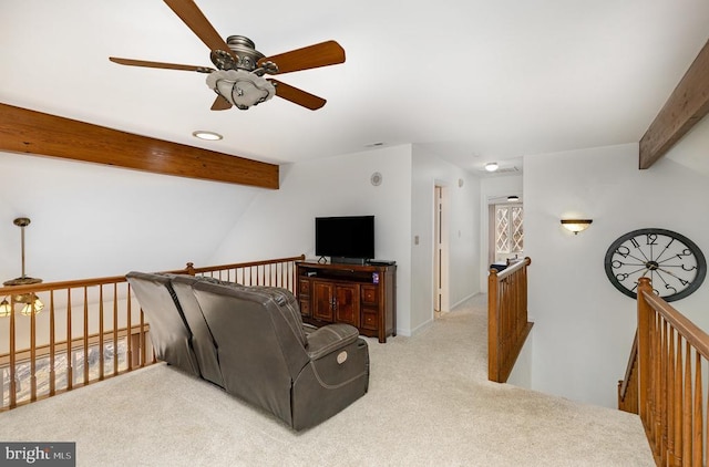carpeted living room with a ceiling fan