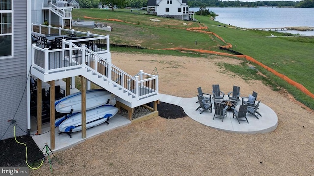 330 Rock Island Rdg, Mineral, VA 23117 - view of green lawn with stairs, a deck with water view, a patio area, and a fire pit