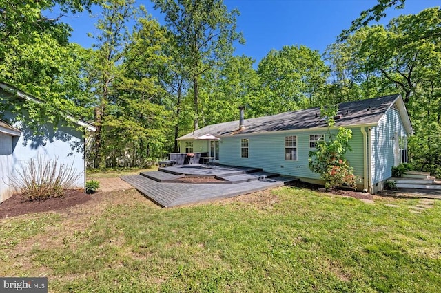13602 Flank March Ln, Spotsylvania, VA 22551 - rear view of house with a patio area, a wooden deck, and a lawn