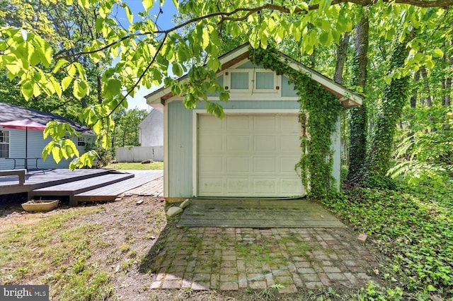 13602 Flank March Ln, Spotsylvania, VA 22551 - garage featuring concrete driveway and fence