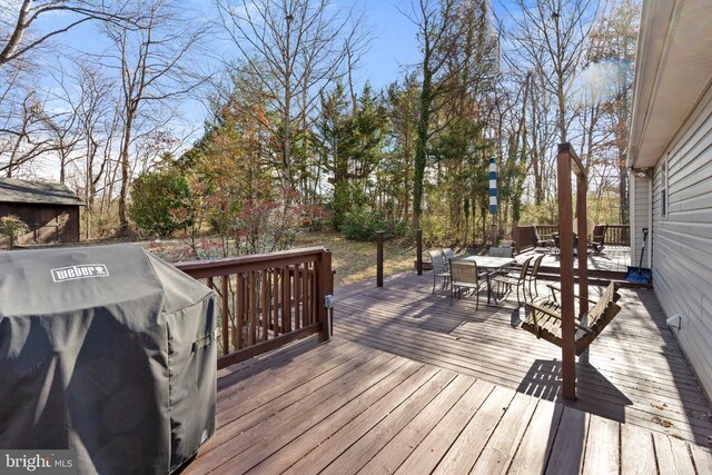 5585 Sperryville Pike, Boston, VA 22713 - wooden deck featuring outdoor dining space and a grill