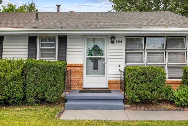2403 Bare St, Staunton, VA 24401 - view of exterior entry featuring brick siding and roof with shingles