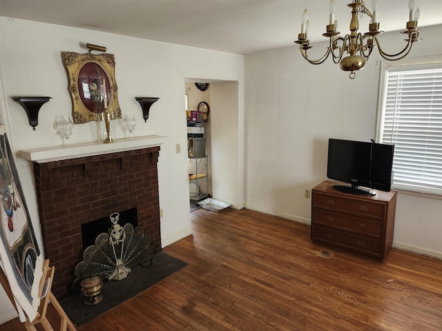living area with wood finished floors, a fireplace, baseboards, and healthy amount of natural light