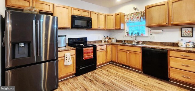 1884 Kennon Rd, Mineral, VA 23117 - kitchen featuring black appliances, light wood-style flooring, and dark countertops