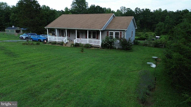 1884 Kennon Rd, Mineral, VA 23117 - view of front of home with covered porch, a front yard, and roof with shingles