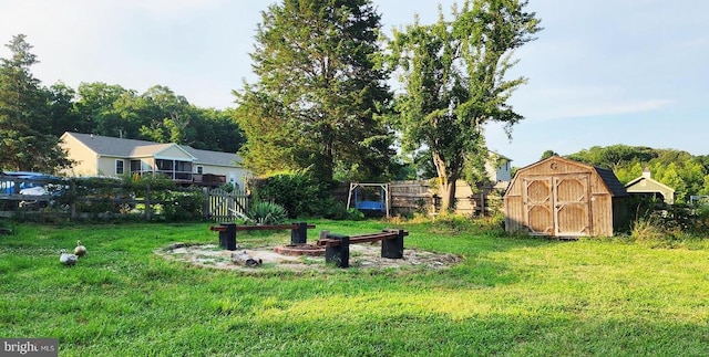 1884 Kennon Rd, Mineral, VA 23117 - view of yard featuring an outdoor fire pit and a storage shed