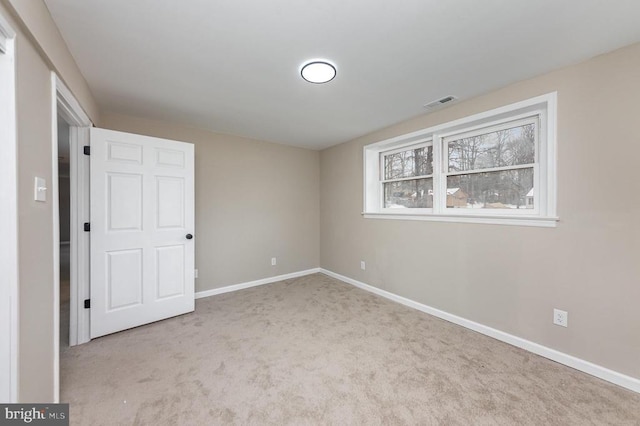 unfurnished bedroom with light colored carpet