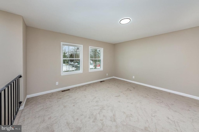 unfurnished room featuring carpet flooring