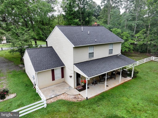 319 Fox Hunters Ln, Madison, VA 22727 - rear view of house featuring roof with shingles, a patio, and a chimney
